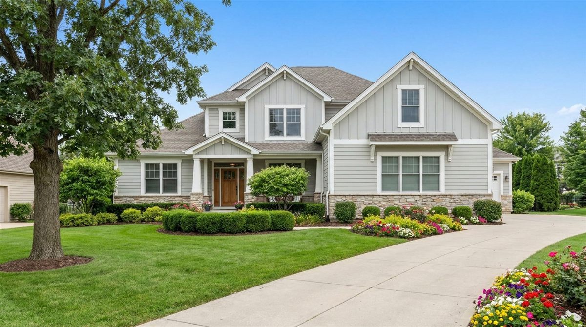 Bright, well-kept single-family home with a green lawn and clear blue sky, the kind of property sellers weigh between Opendoor and local cash-buyer alternatives across U.S. markets