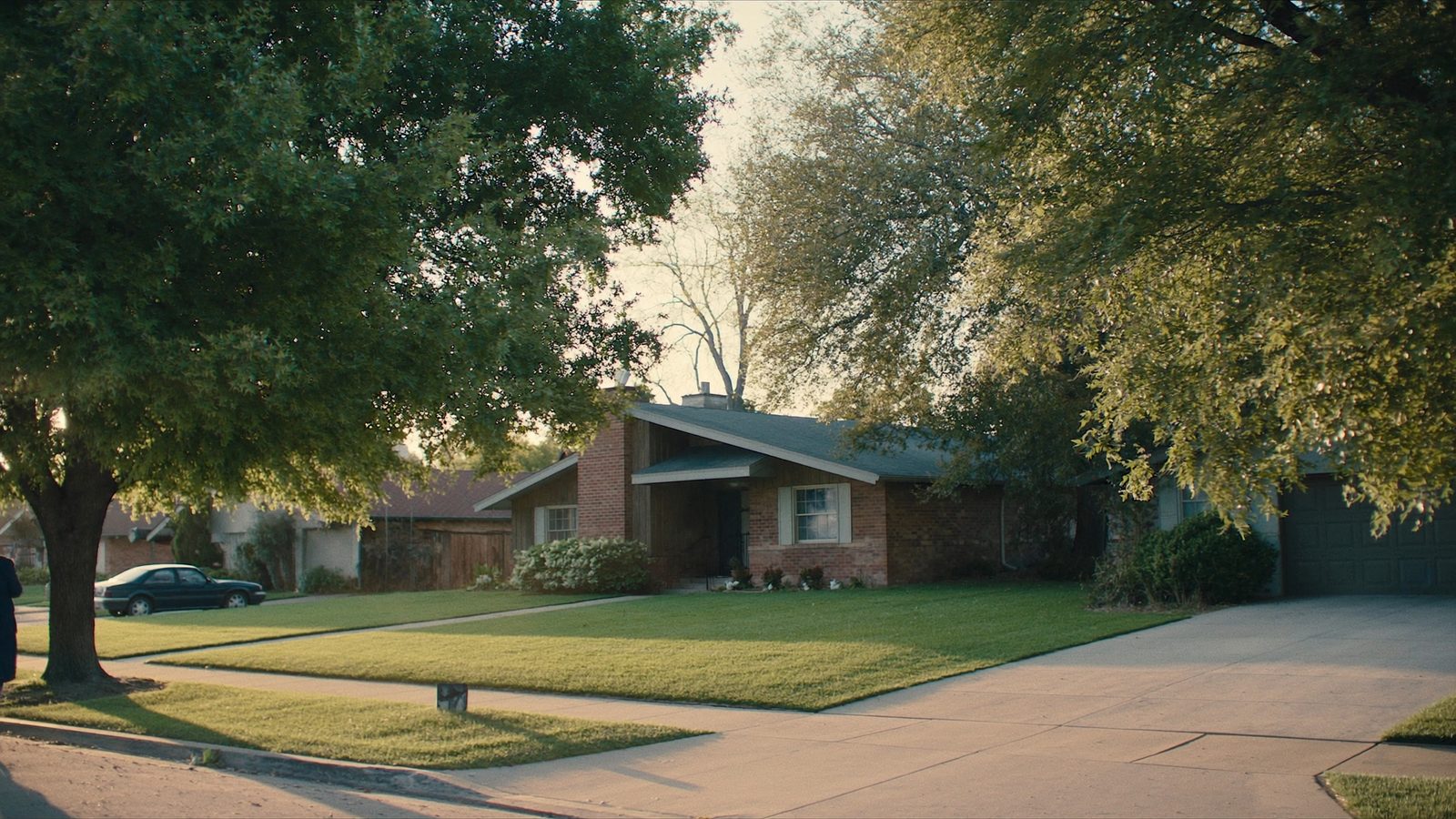 Dallas, Texas suburban neighborhood at golden hour showing typical single-family homes targeted by cash buyers in Dallas County in 2026